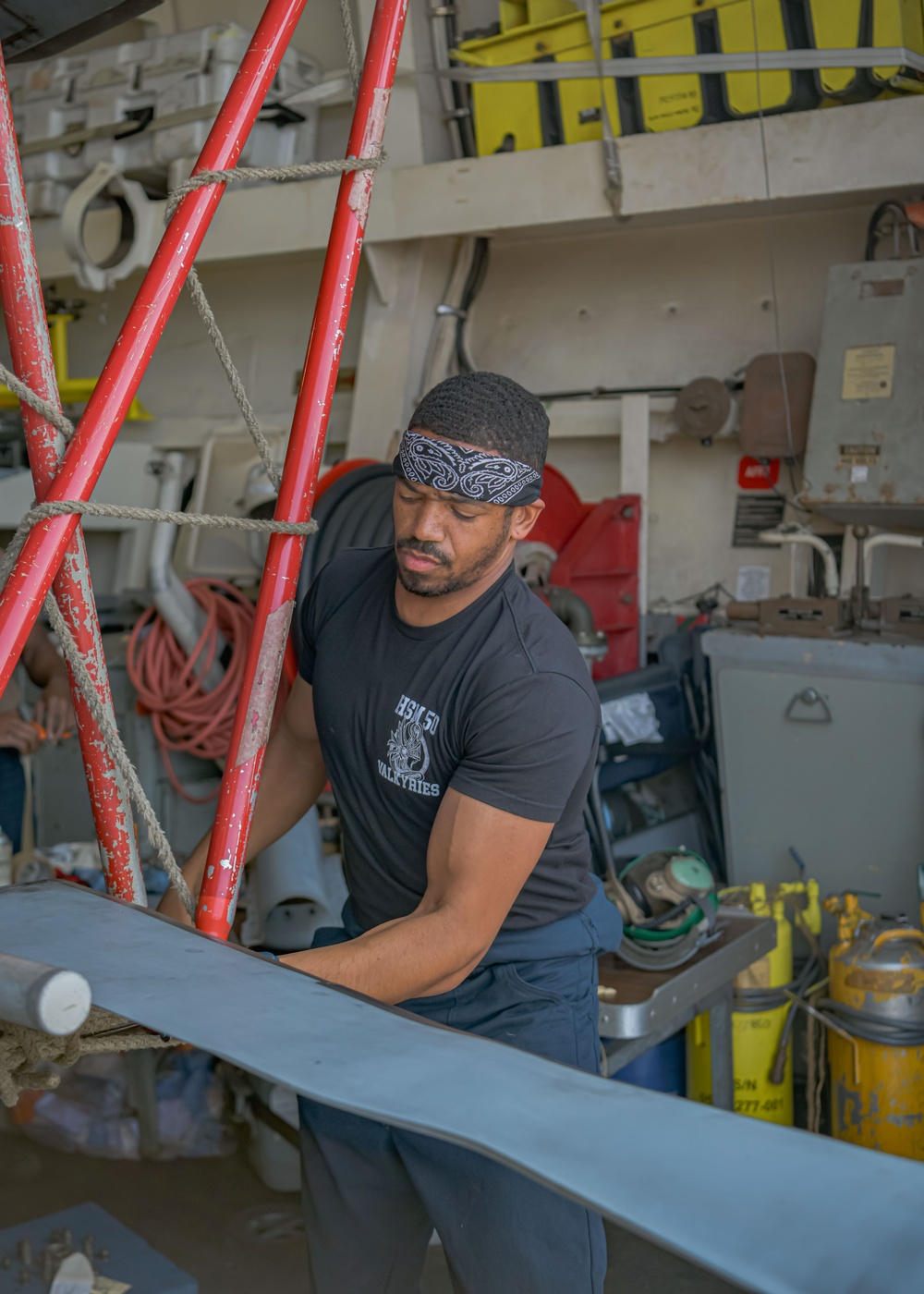 Helicopter Maritime Strike Squadron 50 members conduct repairs on the H-60 Romeo during Exercise Formidable Shield 2023