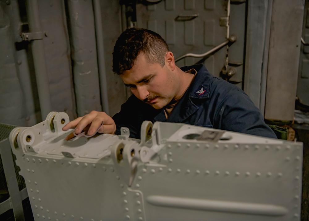 Helicopter Maritime Strike Squadron 50 members conduct repairs on the H-60 Romeo during Exercise Formidable Shield 2023