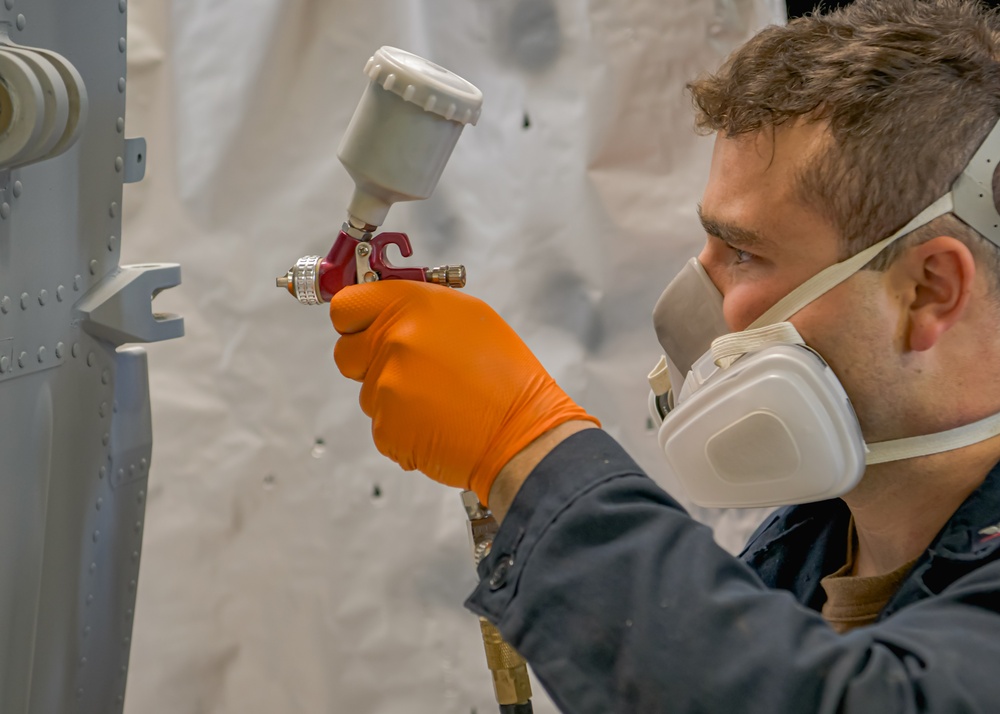 Helicopter Maritime Strike Squadron 50 members conduct repairs on the H-60 Romeo during Exercise Formidable Shield 2023