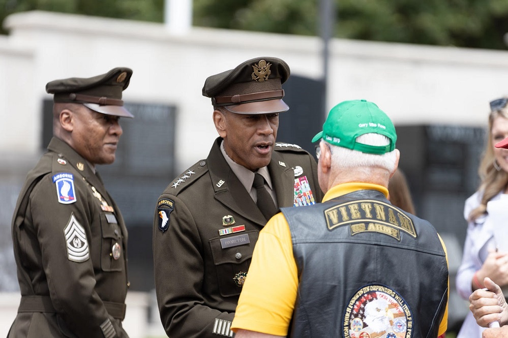 Gen. Hamilton shakes hands with Capt. Mike Rose