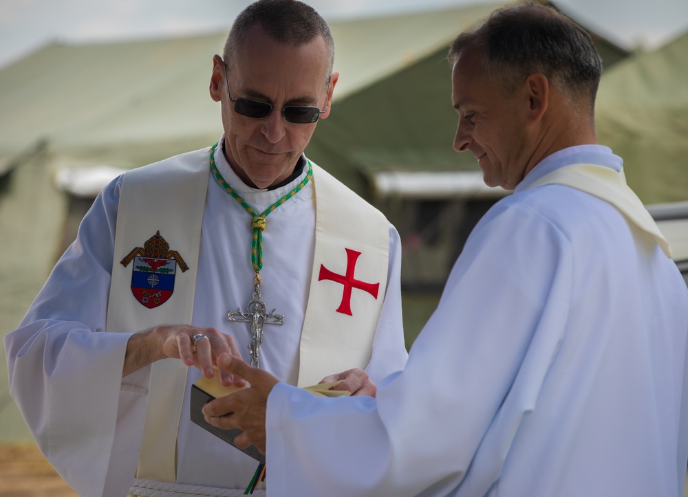 Soldiers in the field during Defender Europe - Saber Guardian attend rare traditional Catholic Mass