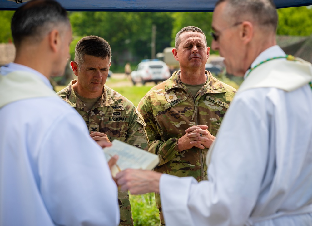 Soldiers in the field during Defender Europe - Saber Guardian attend rare traditional Catholic Mass