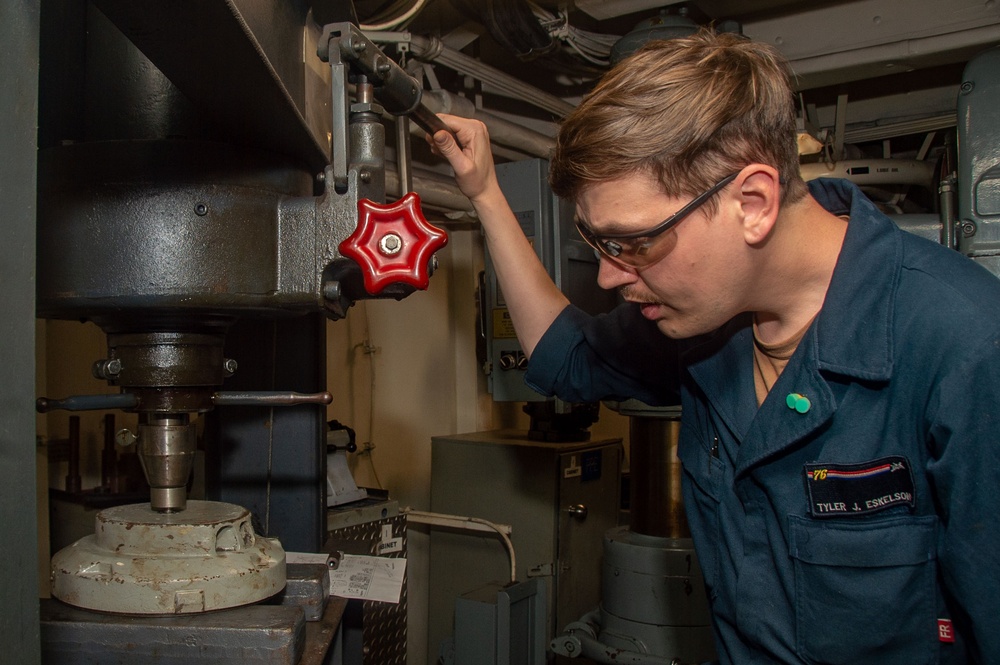 USS Ronald Reagan (CVN 76) Sailors repair a distilling unit