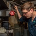 USS Ronald Reagan (CVN 76) Sailors repair a distilling unit