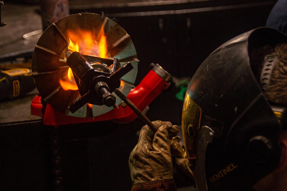 USS Ronald Reagan (CVN 76) Sailors repair a distilling unit