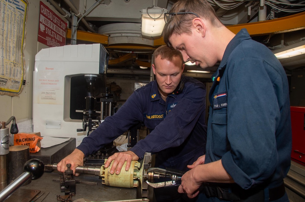 USS Ronald Reagan (CVN 76) Sailors repair a distilling unit