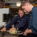 USS Ronald Reagan (CVN 76) Sailors repair a distilling unit