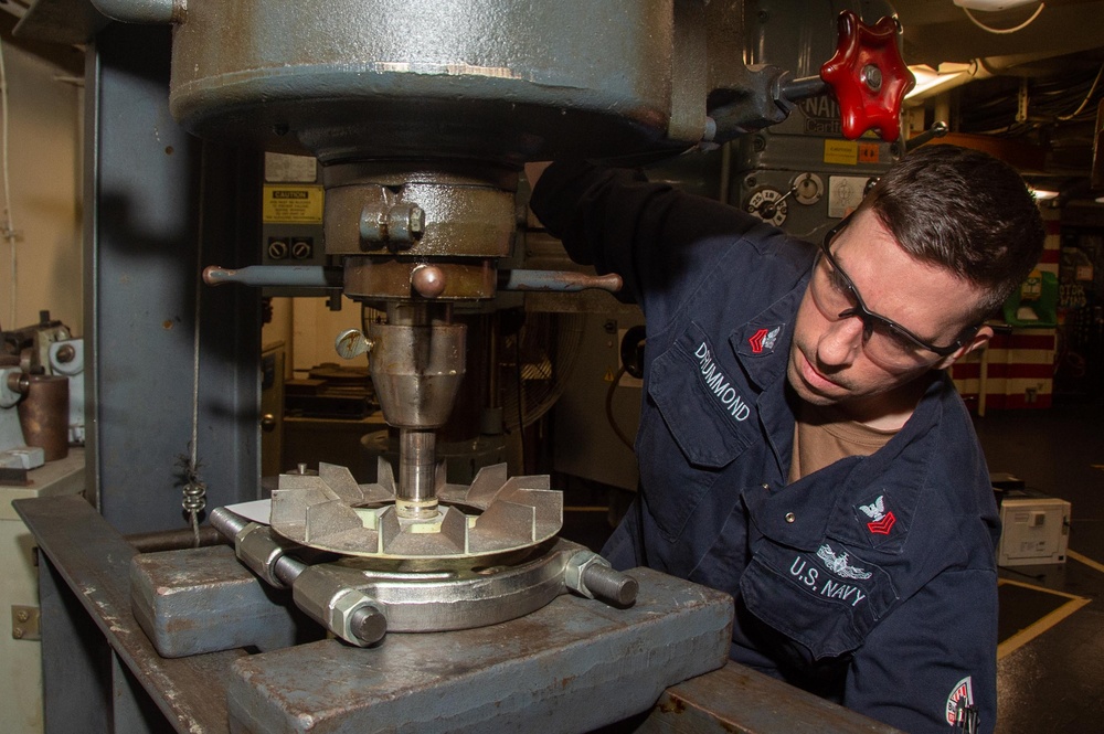 USS Ronald Reagan (CVN 76) Sailors repair a distilling unit