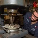 USS Ronald Reagan (CVN 76) Sailors repair a distilling unit