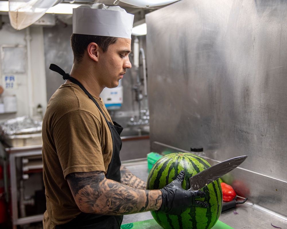 USS Ronald Reagan (CVN 76) Sailors prepare food