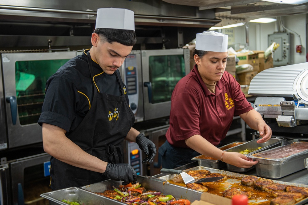 USS Ronald Reagan (CVN 76) Sailors prepare food