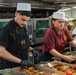 USS Ronald Reagan (CVN 76) Sailors prepare food