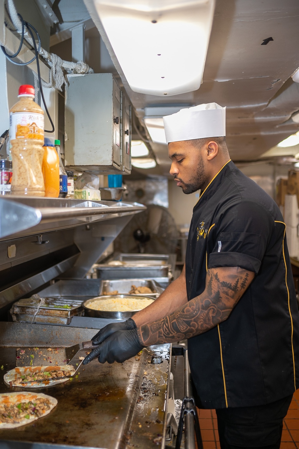 USS Ronald Reagan (CVN 76) Sailors prepare food