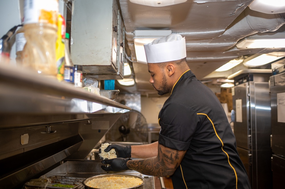 USS Ronald Reagan (CVN 76) Sailors prepare food