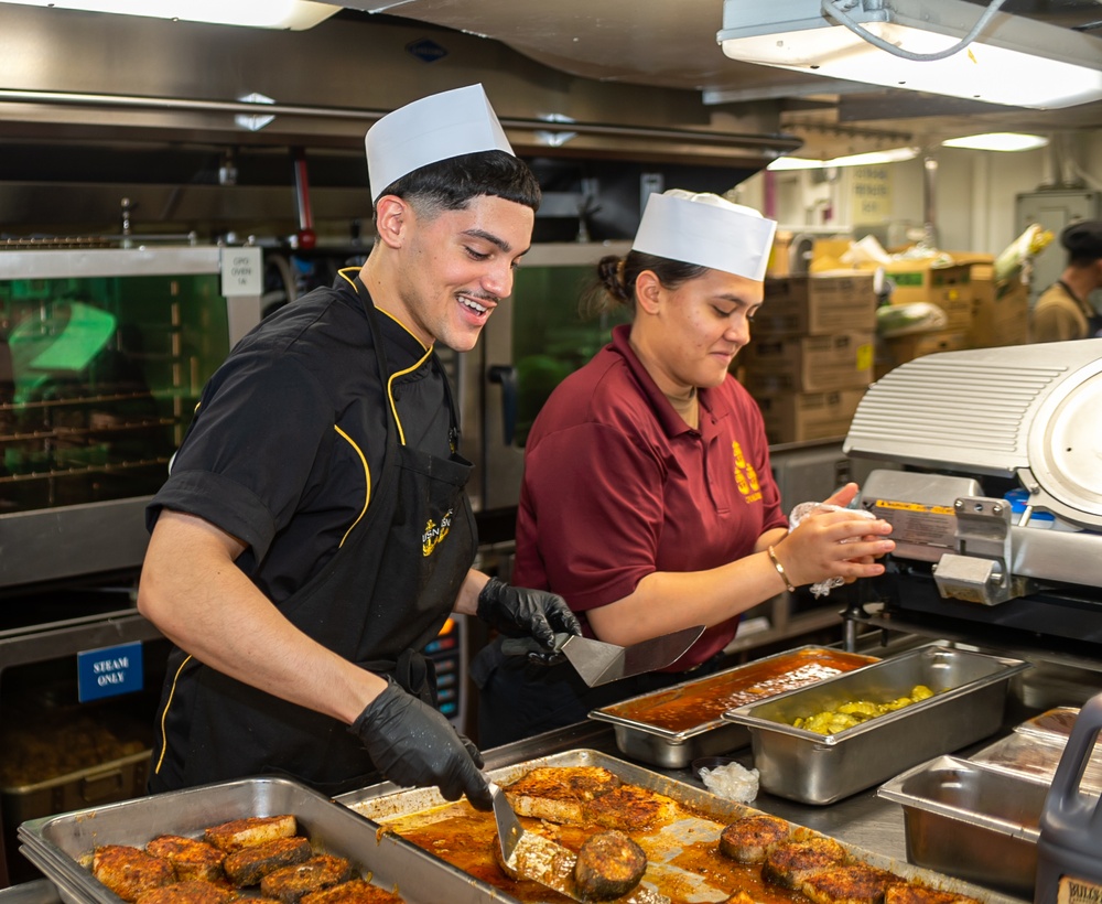 USS Ronald Reagan (CVN 76) Sailors prepare food