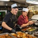 USS Ronald Reagan (CVN 76) Sailors prepare food