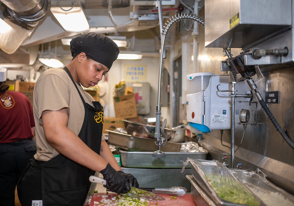 USS Ronald Reagan (CVN 76) Sailors prepare food