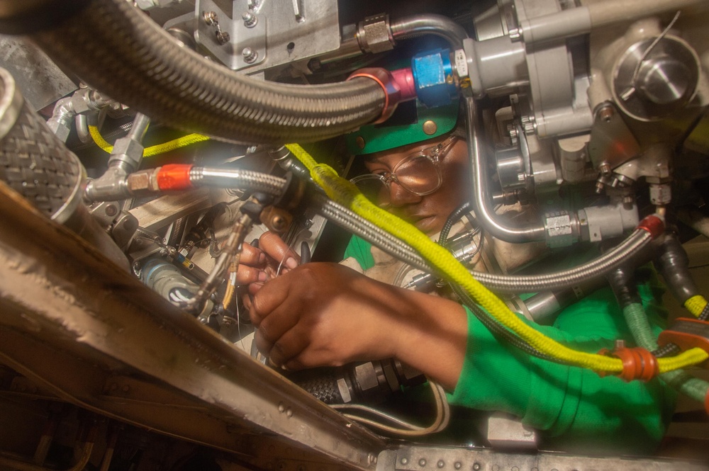 USS Ronald Reagan (CVN 76) Sailors conduct aircraft maintenance