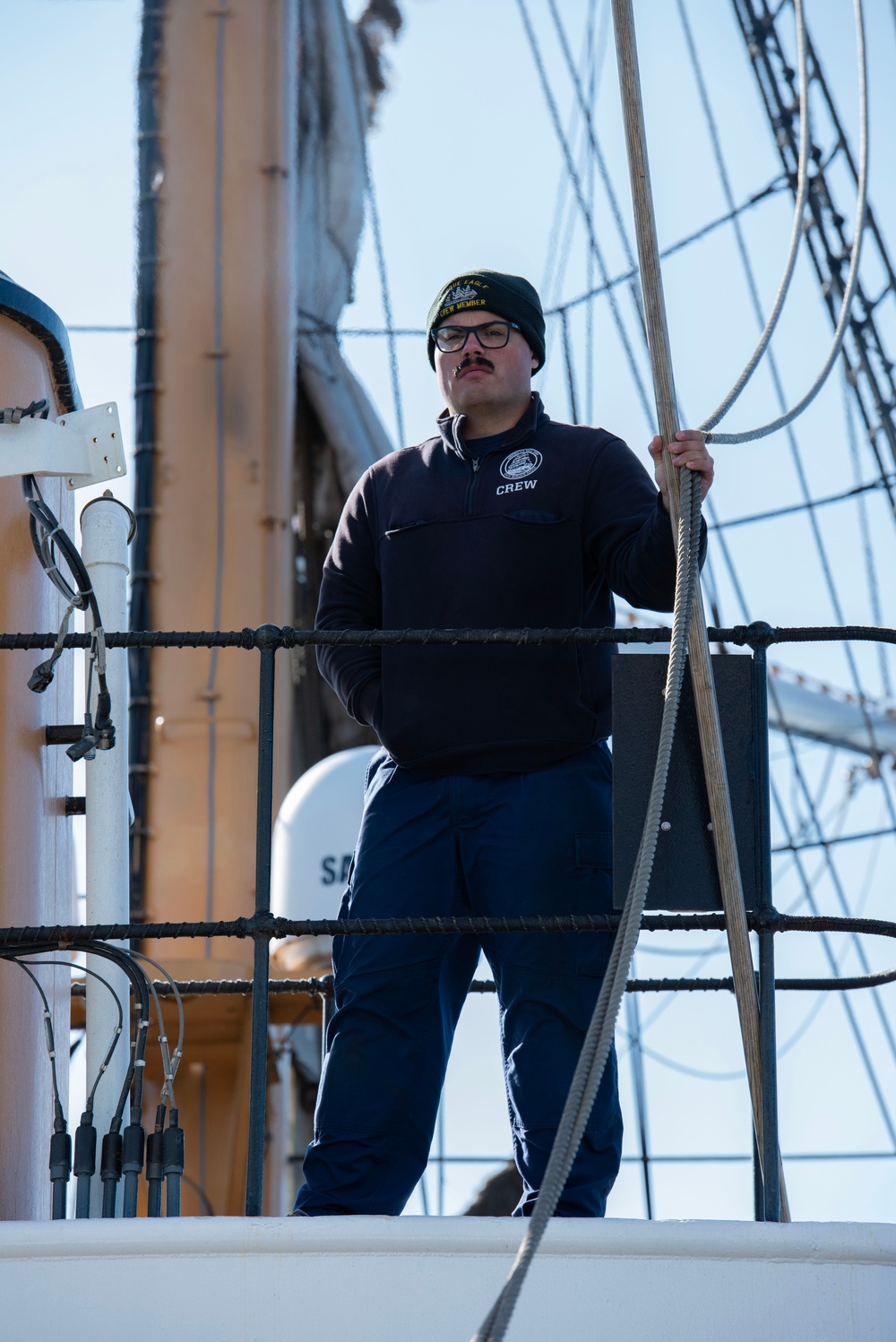 USCGC Eagle crew member at sail station