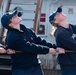 Coast Guard Cadets tug line on USCGC Eagle