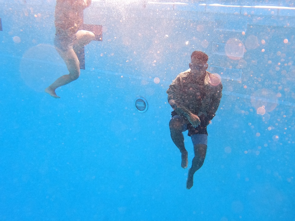 Servicemembers participate in Marine Corps Instructor of Water Survival course