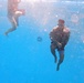 Servicemembers participate in Marine Corps Instructor of Water Survival course