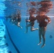 Servicemembers participate in Marine Corps Instructor of Water Survival course