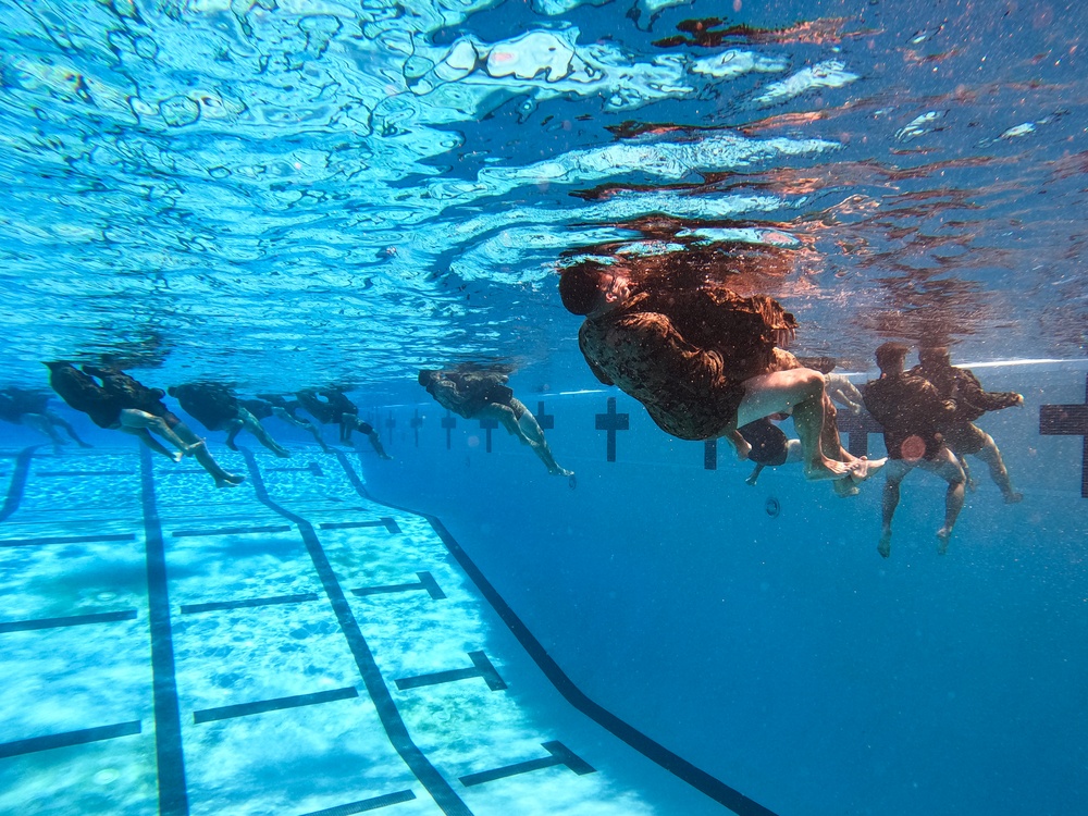 Servicemembers participate in Marine Corps Instructor of Water Survival course