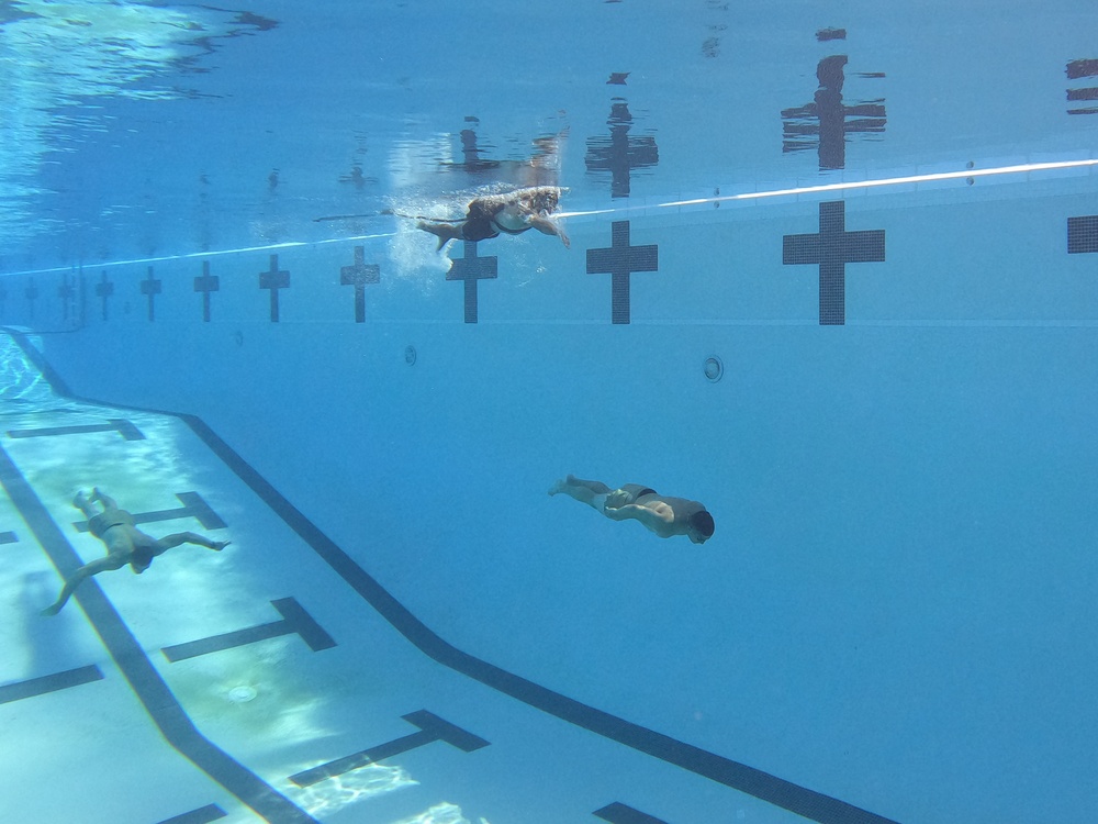 Servicemembers participate in Marine Corps Instructor of Water Survival course