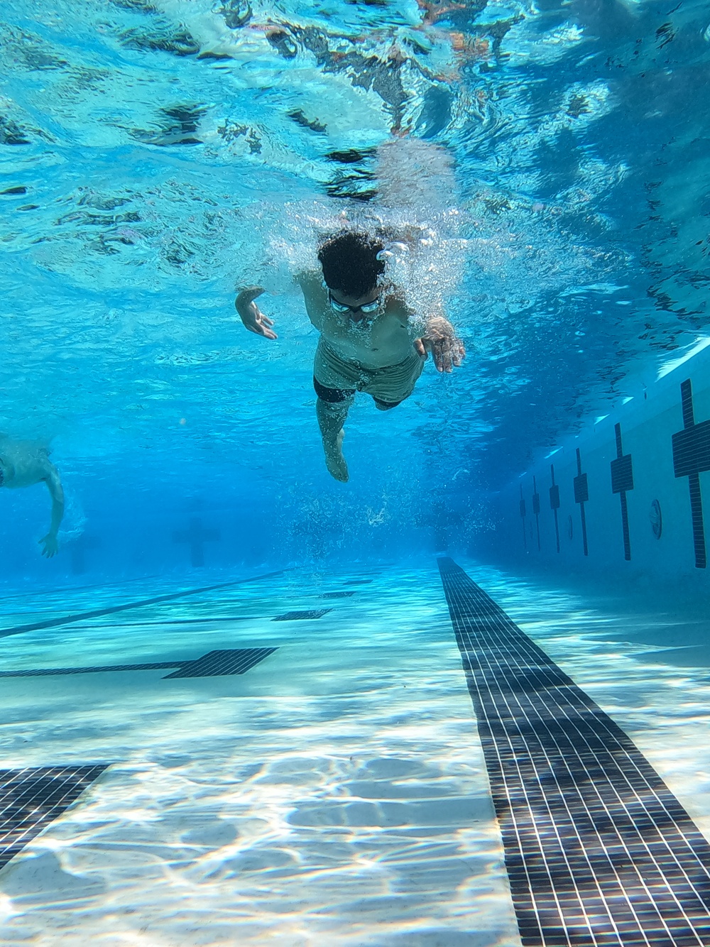 Servicemembers participate in Marine Corps Instructor of Water Survival course