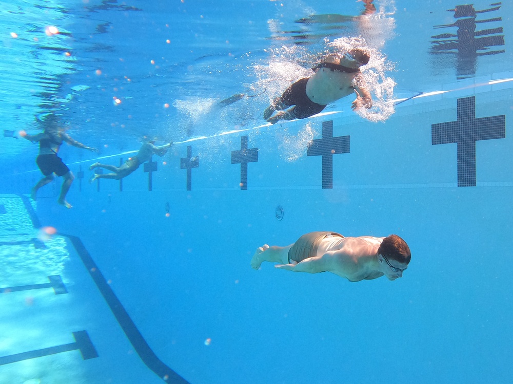 Servicemembers participate in Marine Corps Instructor of Water Survival course