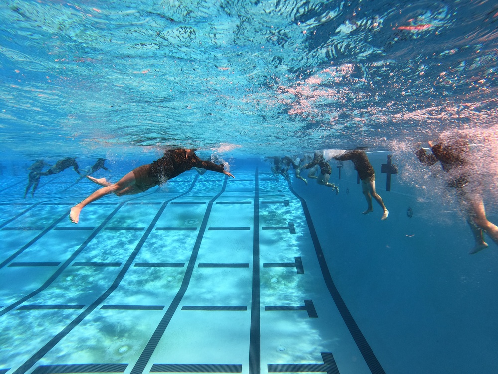 Servicemembers participate in Marine Corps Instructor of Water Survival course