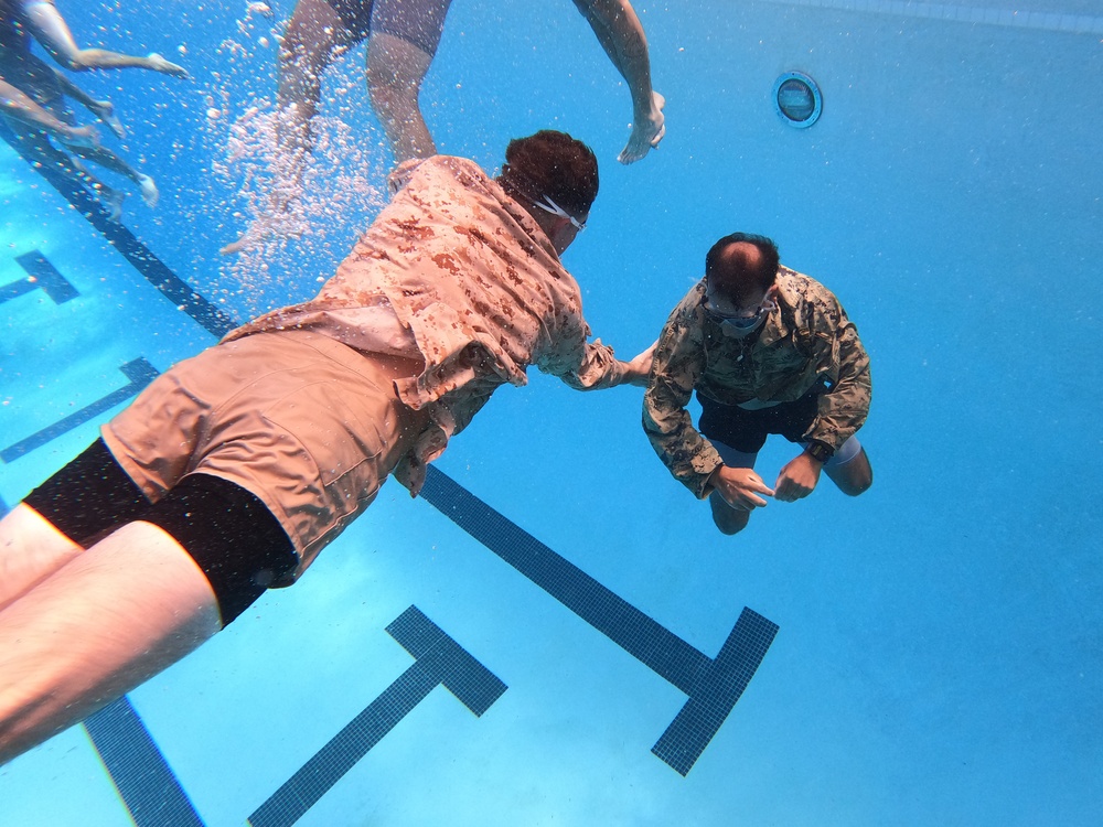 Servicemembers participate in Marine Corps Instructor of Water Survival course