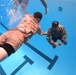 Servicemembers participate in Marine Corps Instructor of Water Survival course