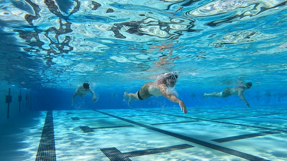 Servicemembers participate in Marine Corps Instructor of Water Survival course