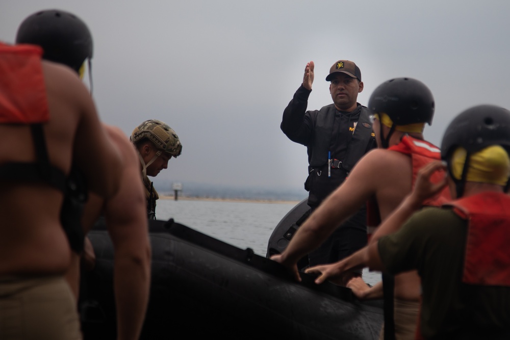 Servicemembers perform simulated rescues in Marine Corps Instructor of Water Survival course