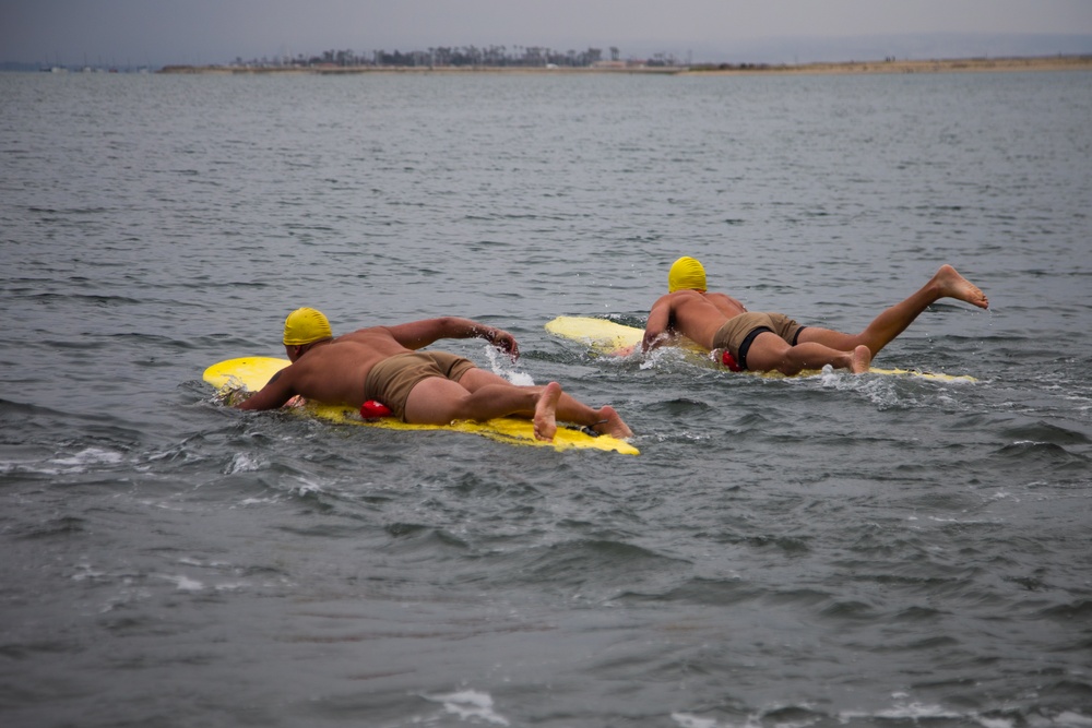 Servicemembers perform simulated rescues in Marine Corps Instructor of Water Survival course