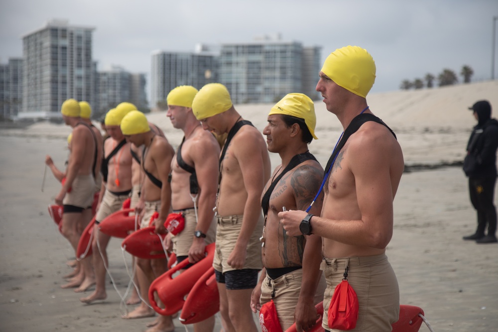 Servicemembers perform simulated rescues in Marine Corps Instructor of Water Survival course