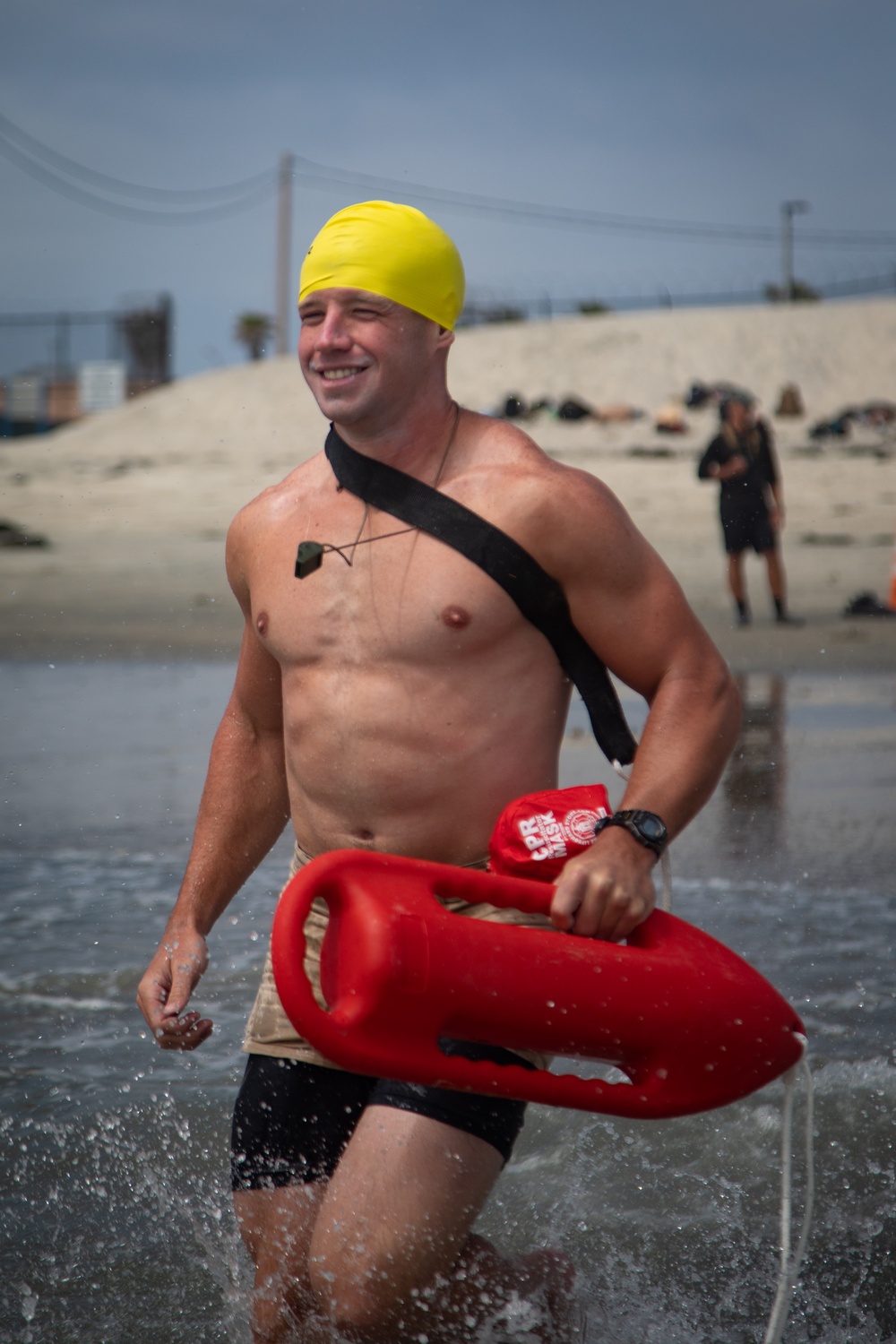 Servicemembers perform simulated rescues in Marine Corps Instructor of Water Survival course