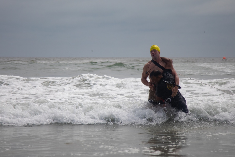 Servicemembers perform simulated rescues in Marine Corps Instructor of Water Survival course