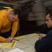 U.S Navy Sailor Signs Paper