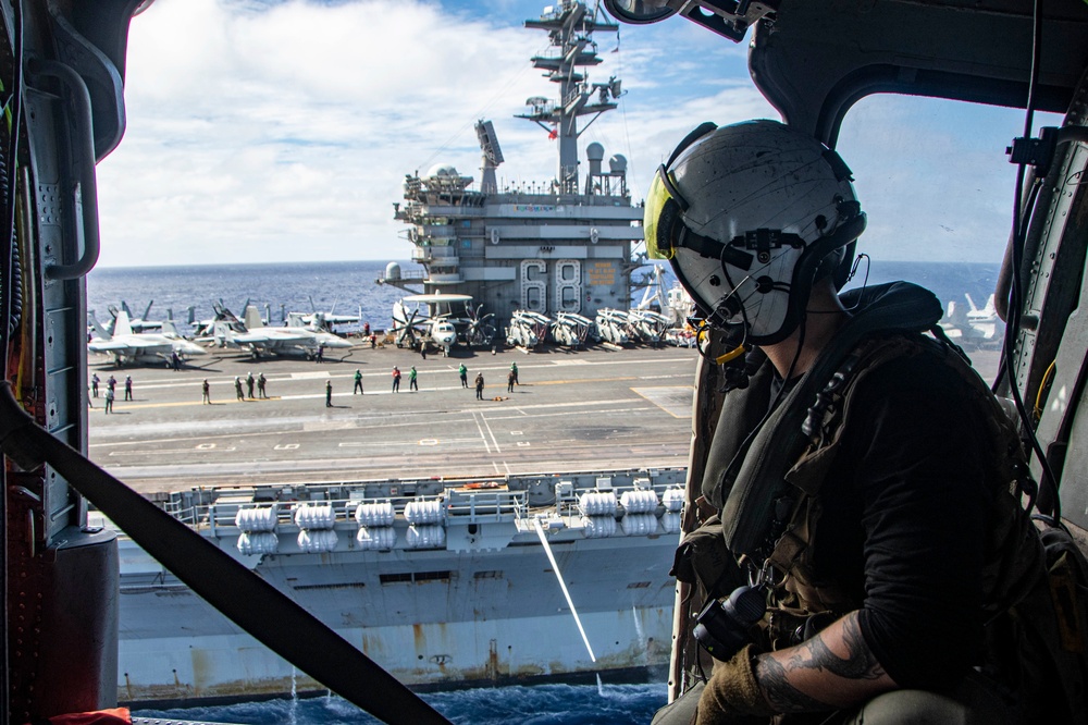 U.S Navy Sailor Rides In Helicopter