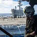 U.S Navy Sailor Rides In Helicopter