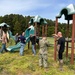 Pax Volunteers Dismantle Aging Equipment for New Playground Construction at Pax