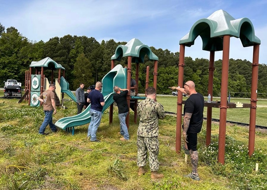 Pax Volunteers Dismantle Aging Equipment for New Playground Construction at Pax