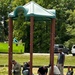 Pax Volunteers Dismantle Aging Equipment for New Playground Construction at Pax