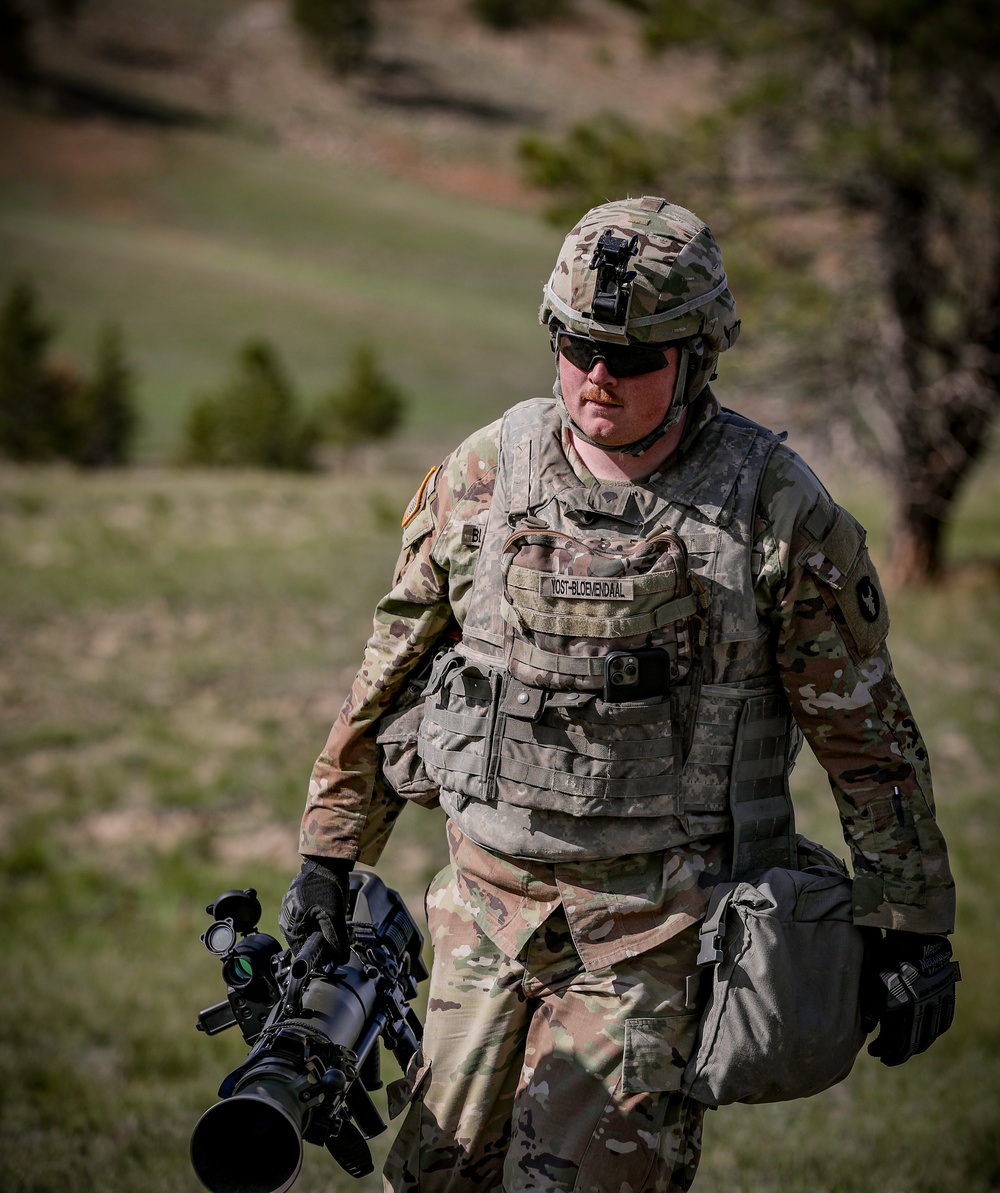 Iowa infantrymen carries M3A1 recoilless rifle