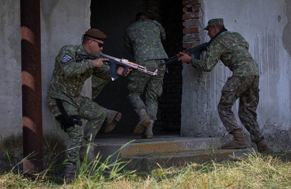 Romanian Soldiers with the 9th Mechanized Brigade conduct breach and clear training