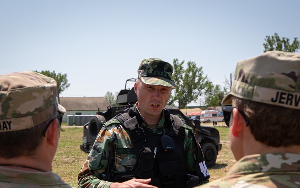 Bulgarian Military Police Service demonstrates VIP escort and protection techniques to Soldiers