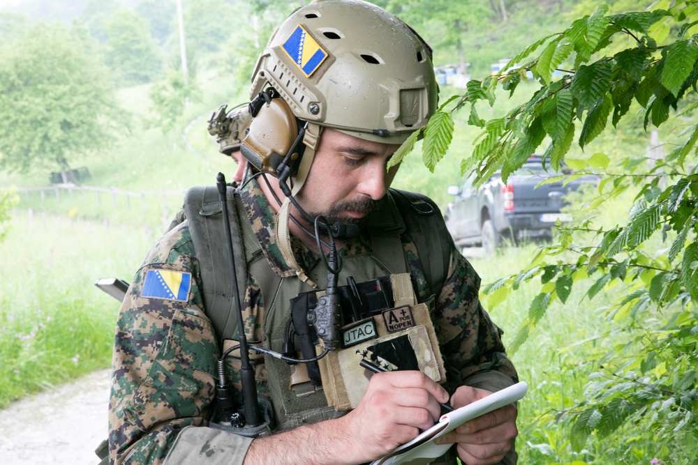 Members of the Armed Forces of Bosnia and Herzegovina’s Joint Terminal Attack Controller (JTAC) team train with US Special Operations Forces to coordinate a training bomber support mission near Tuzla, Bosnia and Herzegovina, 30 MAY 2023.